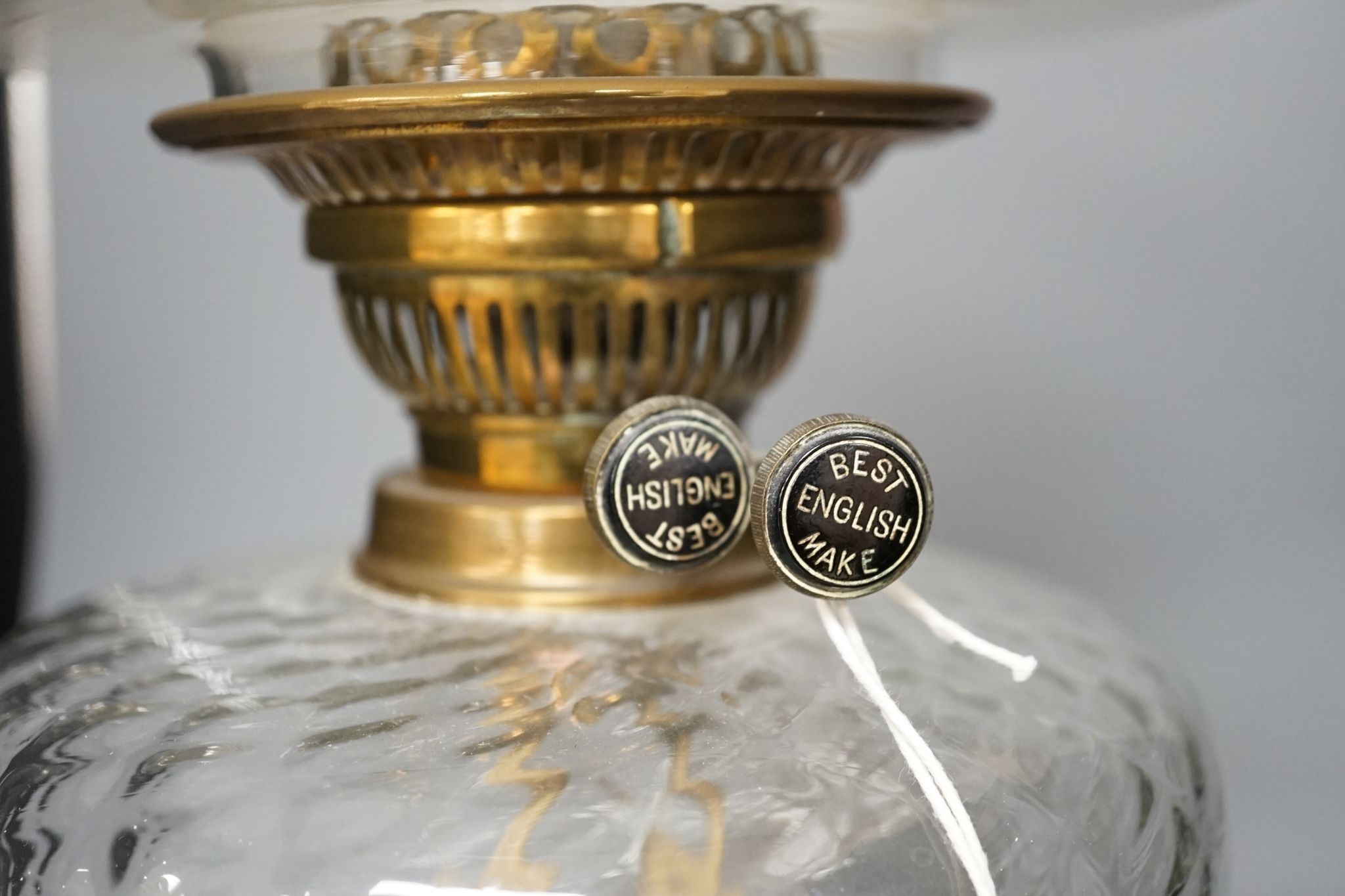 A brass oil lamp with opaque shade 60cm total height